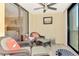 Peaceful lanai features comfortable wicker chairs and tranquil setting at 8750 Midnight Pass Rd # 202, Sarasota, FL 34242