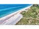 Aerial view of beach access and dune landscape at 8750 Midnight Pass Rd # 202, Sarasota, FL 34242