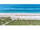 Expansive beach with clear water at 8750 Midnight Pass Rd # 202, Sarasota, FL 34242