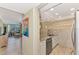 Small galley kitchen with granite countertops and stainless steel appliances at 8750 Midnight Pass Rd # 202, Sarasota, FL 34242