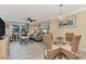 Comfortable living room with blue sofa, coastal decor, and balcony access at 8750 Midnight Pass Rd # 202, Sarasota, FL 34242