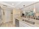 Spacious kitchen with granite countertops, stainless steel appliances, and breakfast bar at 8750 Midnight Pass Rd # 202, Sarasota, FL 34242