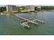 Community boat dock with multiple slips at 8750 Midnight Pass Rd # 202, Sarasota, FL 34242