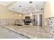 Modern kitchen with granite countertops and stainless steel appliances at 8750 Midnight Pass Rd # 202, Sarasota, FL 34242