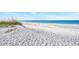 Scenic beach view with white sand and blue water at 8750 Midnight Pass Rd # 202, Sarasota, FL 34242