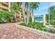 Attractive building exterior with landscaping and signage at 8750 Midnight Pass Rd # 202, Sarasota, FL 34242
