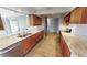 Modern kitchen with granite counters and wood cabinets at 18300 Troon Ave, Port Charlotte, FL 33948