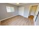 Spacious bedroom with wood-look floors and ample closet space at 18300 Troon Ave, Port Charlotte, FL 33948