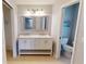 Double vanity bathroom with marble countertop and separate shower at 18300 Troon Ave, Port Charlotte, FL 33948
