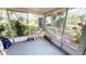 Screened porch with tiled floors and access to backyard at 18300 Troon Ave, Port Charlotte, FL 33948