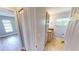 Clean bathroom with updated vanity and tiled floors at 18300 Troon Ave, Port Charlotte, FL 33948