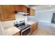 Stainless steel appliances and granite countertops in the kitchen at 18300 Troon Ave, Port Charlotte, FL 33948