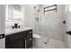 Modern bathroom featuring an illuminated mirror and glass walk-in shower at 5815 Casanova Ave, North Port, FL 34291