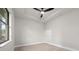 Light-filled bedroom with wood floors and a modern ceiling fan at 5815 Casanova Ave, North Port, FL 34291