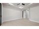 Bright bedroom with ceiling fan and light hardwood flooring at 5815 Casanova Ave, North Port, FL 34291