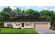 One-story house with a two-car garage and lush lawn at 17184 Wintergarden Ave, Port Charlotte, FL 33948