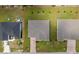 Aerial view of three homes showcasing lot sizes and neighborhood layout at 15512 Greenwood Ave, Port Charlotte, FL 33981