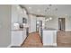 Modern kitchen with white cabinets, granite countertops, and island at 15512 Greenwood Ave, Port Charlotte, FL 33981