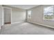 Spacious bedroom with neutral walls and carpet flooring at 15512 Greenwood Ave, Port Charlotte, FL 33981
