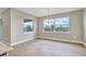 Bright dining room with chandelier and large windows at 15512 Greenwood Ave, Port Charlotte, FL 33981