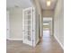 Bright hallway with tile floors and French doors at 15512 Greenwood Ave, Port Charlotte, FL 33981