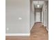 Bright hallway with tile flooring and neutral walls at 15512 Greenwood Ave, Port Charlotte, FL 33981