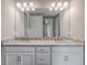 Bathroom with double vanity and granite countertop at 15512 Greenwood Ave, Port Charlotte, FL 33981