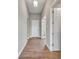 Bright hallway with tile flooring and neutral walls at 15512 Greenwood Ave, Port Charlotte, FL 33981