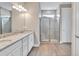 Bathroom with double vanity and a large walk-in shower at 15512 Greenwood Ave, Port Charlotte, FL 33981