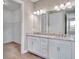 Double vanity bathroom with granite countertops at 15512 Greenwood Ave, Port Charlotte, FL 33981