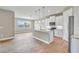 Open kitchen with granite countertops and stainless steel appliances at 15512 Greenwood Ave, Port Charlotte, FL 33981