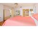 Bedroom with coral bedding and built-in wardrobe at 1081 Coronado Dr, Punta Gorda, FL 33950