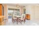 Dining room with glass table, seating for six, and pool view at 1081 Coronado Dr, Punta Gorda, FL 33950