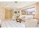 Living room with light-colored furniture and a large window at 1081 Coronado Dr, Punta Gorda, FL 33950