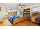 Bedroom with large windows, built-in shelving, and hardwood floors at 1081 Coronado Dr, Punta Gorda, FL 33950