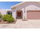 Attractive entryway with arched doorway and garage at 1081 Coronado Dr, Punta Gorda, FL 33950