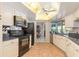 Modern kitchen featuring black appliances and granite countertops at 1081 Coronado Dr, Punta Gorda, FL 33950