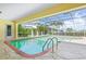Inviting screened-in pool area with a view of the canal at 1081 Coronado Dr, Punta Gorda, FL 33950