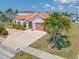 Single-story home with tile roof and attached garage at 1081 Coronado Dr, Punta Gorda, FL 33950