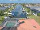 Aerial view of canal-front property with pool and boat docks at 1081 Coronado Dr, Punta Gorda, FL 33950
