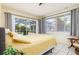 Main bedroom with sliding glass doors opening to the pool area at 1081 Coronado Dr, Punta Gorda, FL 33950
