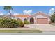 Ranch-style home with terracotta roof and landscaping at 1081 Coronado Dr, Punta Gorda, FL 33950