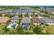 Aerial view of a house with a screened-in pool and patio at 4093 River Bank Way, Punta Gorda, FL 33980