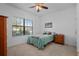Bright bedroom with a full-size bed and window seating at 4093 River Bank Way, Punta Gorda, FL 33980