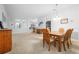 Casual dining area with a wood table and chairs, view of kitchen at 4093 River Bank Way, Punta Gorda, FL 33980