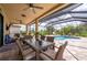 Enjoy the screened-in pool and patio area, perfect for outdoor dining and relaxation at 4093 River Bank Way, Punta Gorda, FL 33980