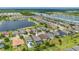 Aerial view highlighting a house with a pool and screened enclosure at 4093 River Bank Way, Punta Gorda, FL 33980