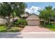 Attractive single-Gathering home with a brick driveway and lush landscaping at 4093 River Bank Way, Punta Gorda, FL 33980