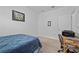 Small bedroom with a full size bed and workspace at 4093 River Bank Way, Punta Gorda, FL 33980