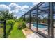 Enjoy the backyard oasis with a relaxing pool and lush landscaping at 4093 River Bank Way, Punta Gorda, FL 33980